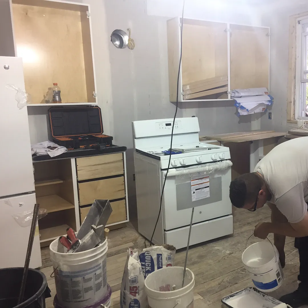 Custom kitchen shaker doors painted white.